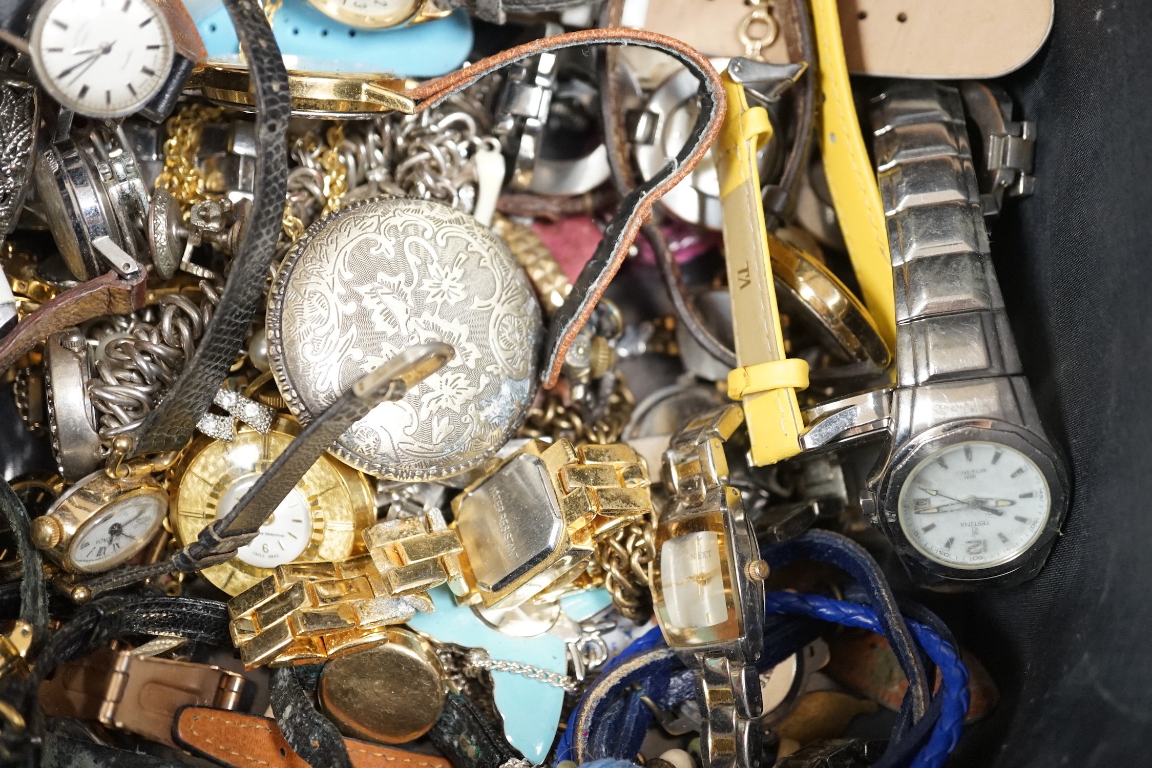 A group of assorted mainly modern lady's wrist watches, including some gentleman's and some pocket watches.